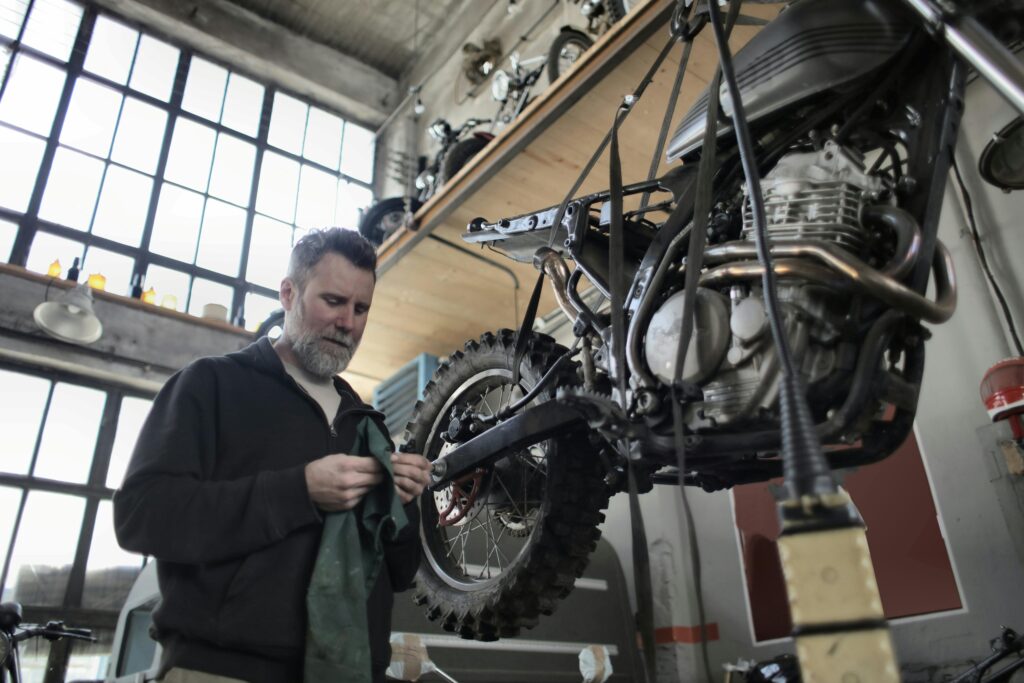 Mechanic fixing motorcycle