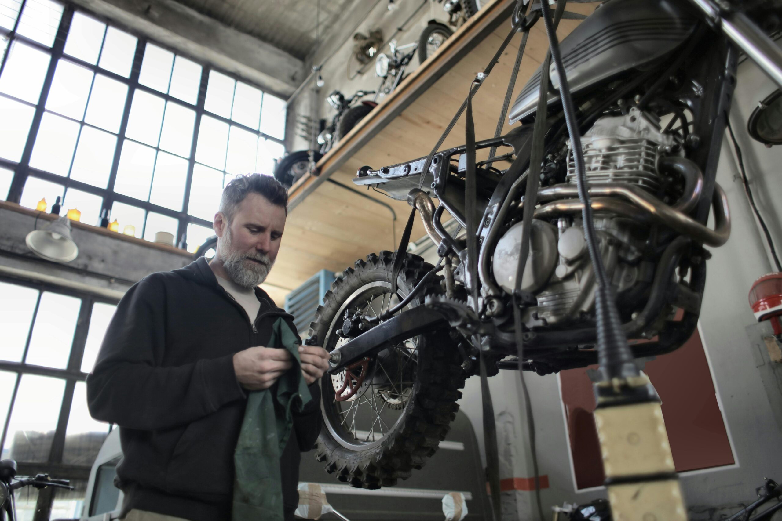 Mechanic fixing motorcycle